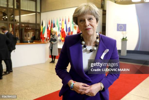 Britain's Prime minister Theresa May leaves the European Council headquarter in Brussels, on March 23, 2018 in the night at the end of the first day...