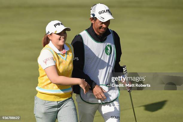 Himawari Ogura of Japan celebrates with her caddie on the 9th green during the first round of the AXA Ladies Golf Tournament In Miyazaki at the UMK...