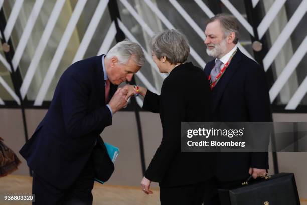 Michel Barnier, chief negotiator for the European Union , left, greets Theresa May, U.K. Prime minister, center, as Tim Barrow, U.K. Permanent...