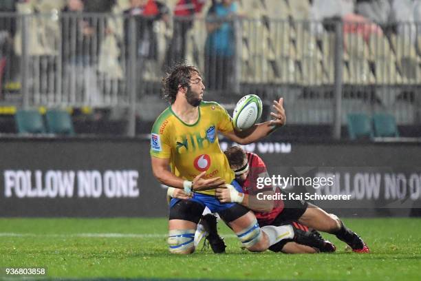 Lood de Jager of the Bulls offloads the ball during the round six Super Rugby match between the Crusaders and the Bulls on March 23, 2018 in...