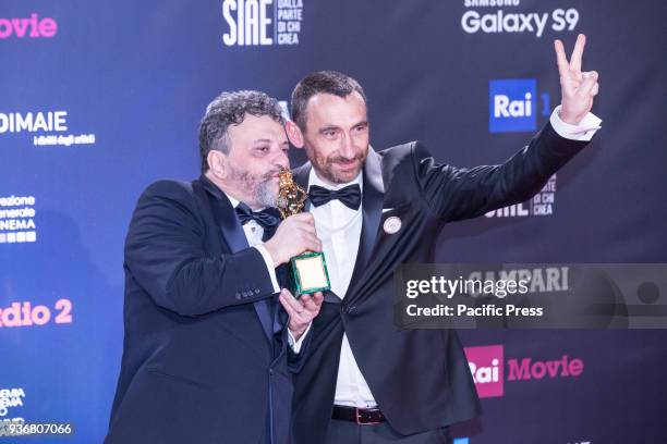 Marco Manetti and Antonio Manetti winners of the David di Donatello for best movie.