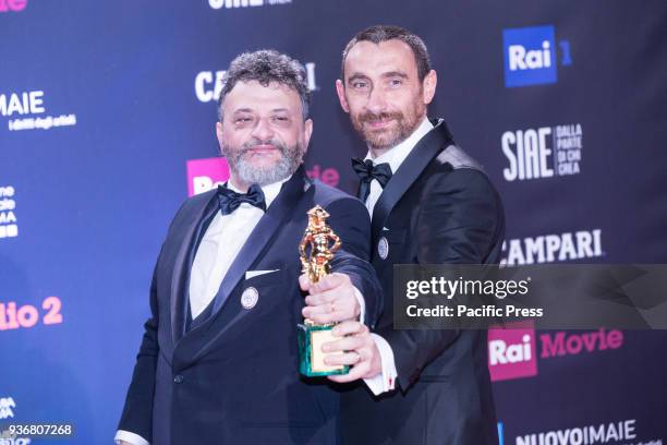 Marco Manetti and Antonio Manetti winners of the David di Donatello for best movie.