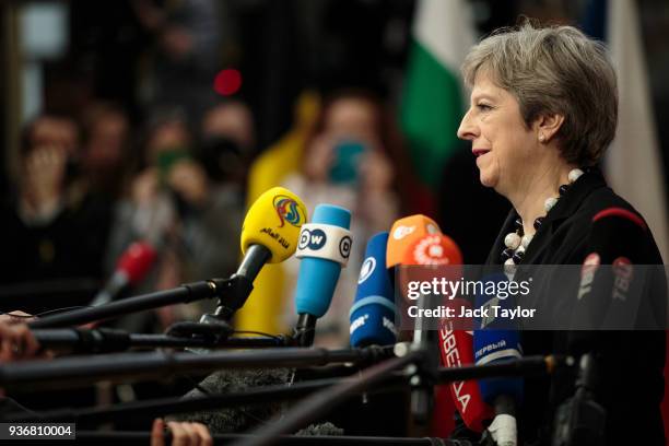 British Prime Minster Theresa May speaks to the media as she arrives at the Council of the European Union on the final day of the European Council...