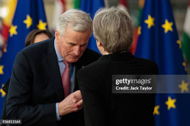 Chief negotiator for the European Union Michel Barnier greets British Prime Minster Theresa May on arrival at the Council of the European Union on...