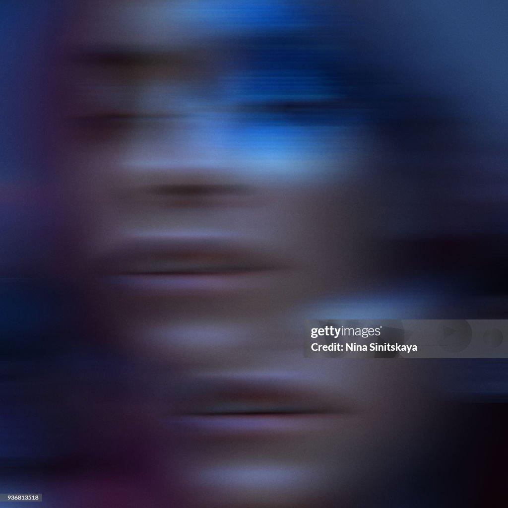 Blured motion portrait of female face in ultraviolet tones