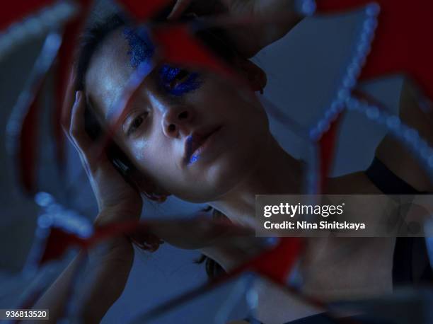 reflection of woman in broken mirror - people mosaic human face stock pictures, royalty-free photos & images