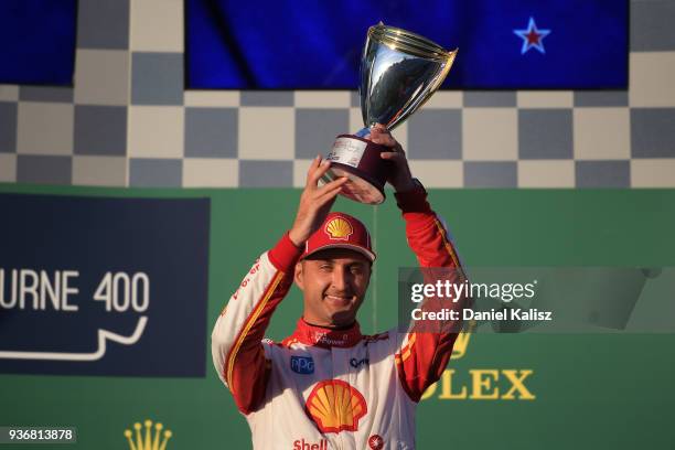 3rd place Fabian Coulthard driver of the Shell V-Power Racing Team Ford Falcon FGX celebrates on the podium during race 1 for the Supercars...