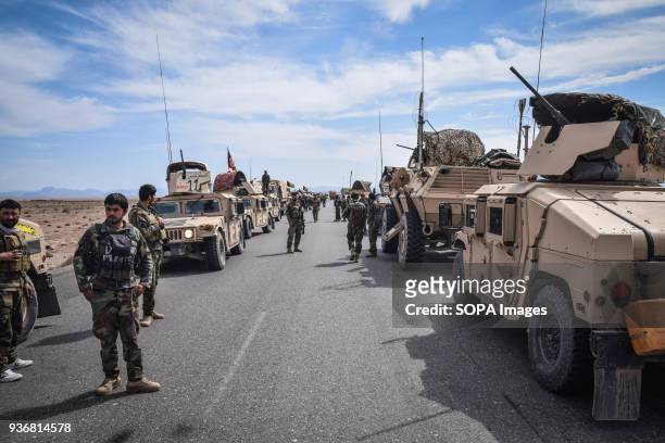 Afghan Commandos during a rest between their convoys consisting of HMMWVs and Mobile Strike Force Vehicles, somewhere on the main road in Bolo Bluk...