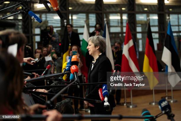 British Prime Minster Theresa May speaks to the media as she arrives at the Council of the European Union on the final day of the European Council...
