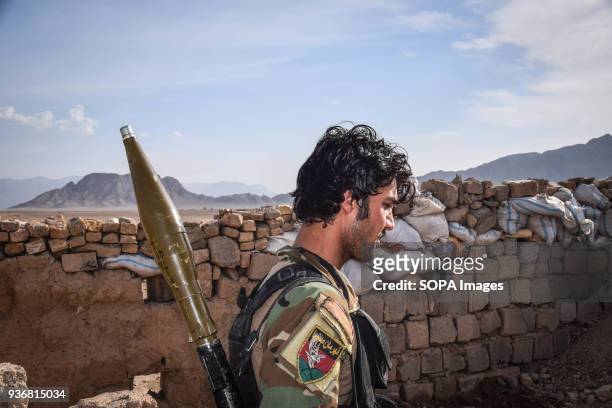 Afghan Commando with an RPG in the remains of an Afghan National Defence and Security Forces Outpost behind Farahrud Bazaar, just off the main road...