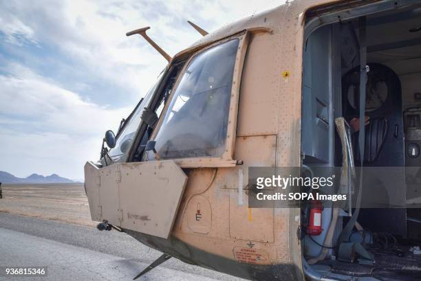 Nose of a Mi-17 transport helicopter of the Afghan Air Force, sitting on the tarmac of the main road somewhere in Bolo Bluk district, Farah province....
