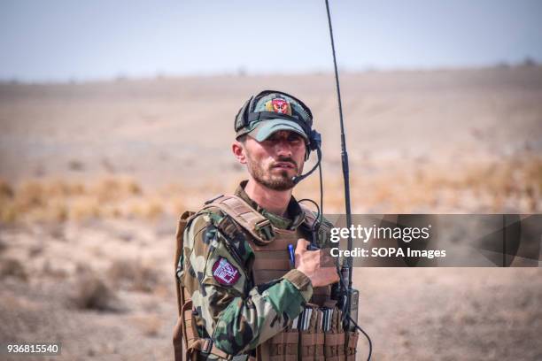Afghan Commando with radio equipment, somewhere on the main road in Bolo Bluk district, Farah province. Afghanistans elite military forces the...