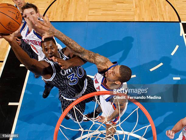 Brandon Bass of the Orlando Magic shoots against Wilson Chandler of the New York Knicks during the game on December 2, 2009 at Amway Arena in...