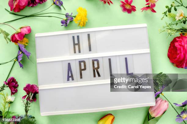 april message in lightbox. floral and gren bacground - floral calendar 2018 stock-fotos und bilder