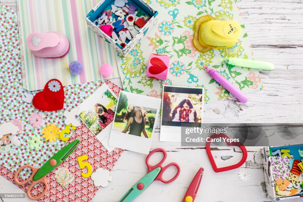 'Assortment of scrapbooking tools including colored paper, pens, and scissors.Click below for more of my scrapbooking and arts and crafts images: