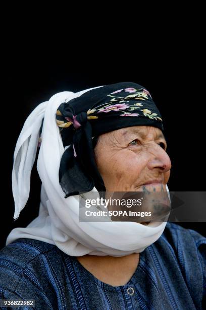 Aisha Mustafa, 70 year-old, from Kobani, Syria, photographed at refugee camp in Turkey. The practice of facial tattoos stopped about 50 years...