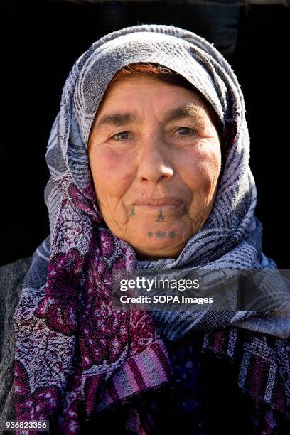 Fatima Habash from Kobani, Syria and a mother of 8 children at refugee camp in Turkey. The practice of facial tattoos stopped about 50 years earlier,...