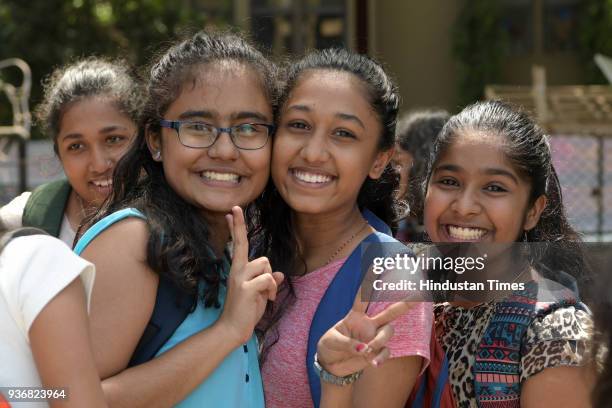 Students greet each other after appearing for the year's last SSC board Exam Paper at Fr Agnel School Vashi, on March 22, 2018 in Mumbai, India.