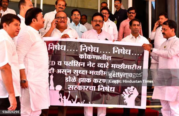 Opposition party MLAs protested against the usage of illegal fishing net and LED light in Konkan coastal region during the budget session at Vidhan...
