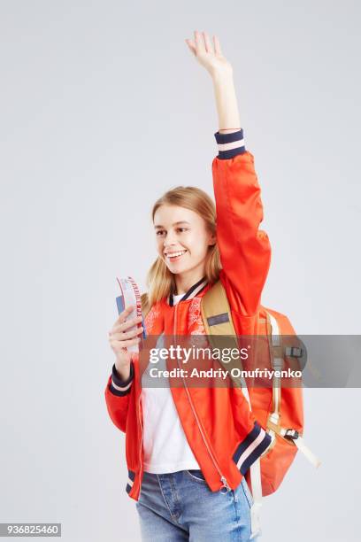 studio portrait of blond woman wearing backpack - andriy onufriyenko stockfoto's en -beelden