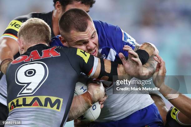 David Klemmer of the Bulldogs is tackled during the round three NRL match between the Bulldogs and the Panthers at ANZ Stadium on March 23, 2018 in...