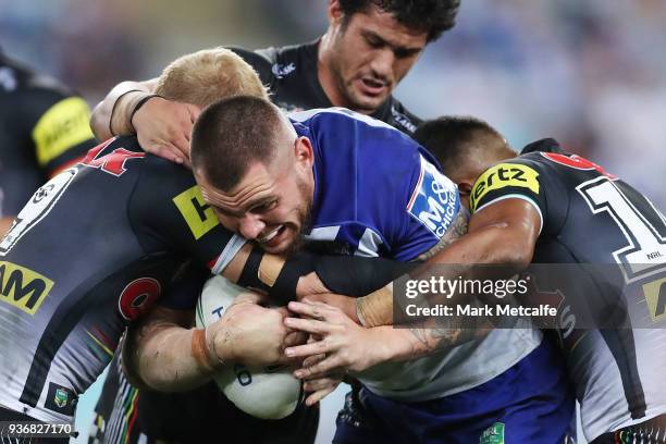 David Klemmer of the Bulldogs is tackled during the round three NRL match between the Bulldogs and the Panthers at ANZ Stadium on March 23, 2018 in...