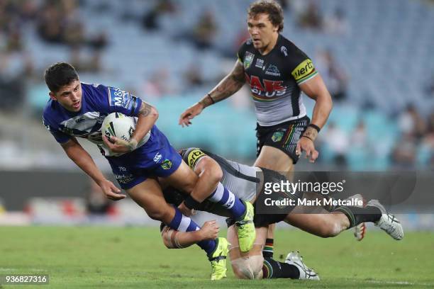 Jeremy Marshall-King of the Bulldogs is tackled during the round three NRL match between the Bulldogs and the Panthers at ANZ Stadium on March 23,...