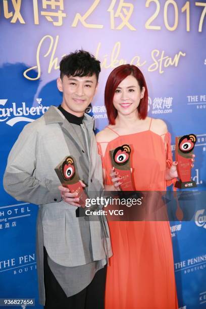 Actor Raymond Lam and actress Jessica Hester Hsuan pose with trophies during 2017 Hong Kong Weibo Awards Ceremony on March 22, 2018 in Hong Kong,...