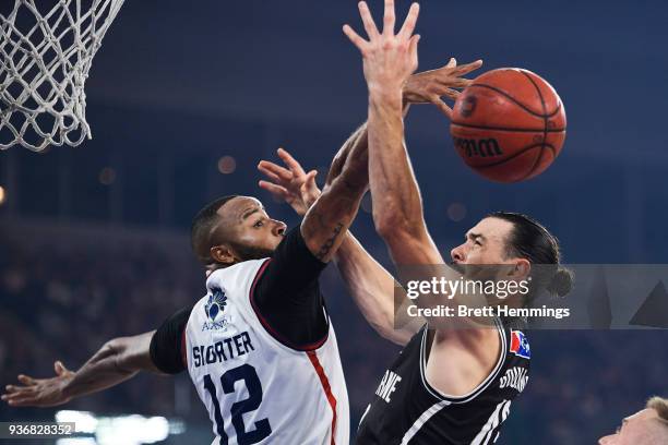 Chris Goulding of Melbourne is defended by Shannon Shorter of the 36ers during game three of the Grand Final series between Melbourne United and the...
