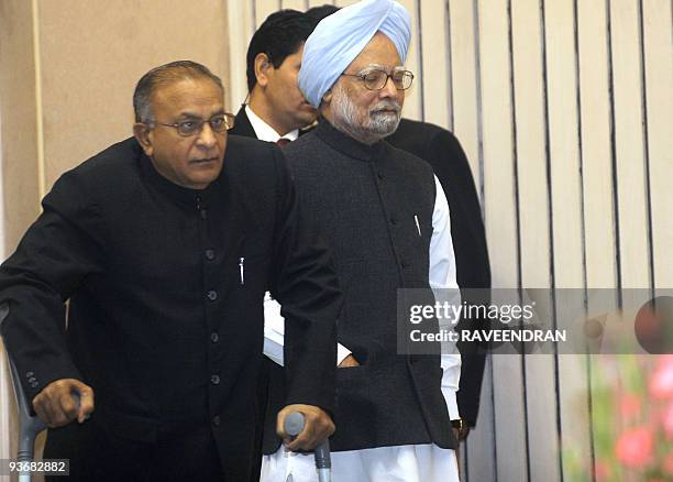 Indian Prime Minister Manmohan Singh and Minister of Urban Development Jaipal Reddy arrive for the National Conference of Jawaharlal Nehru Urban...