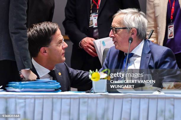 European Commission President Jean-Claude Juncker talks with Netherland's Prime minister Mark Rutte during a meeting on the second day of a summit of...