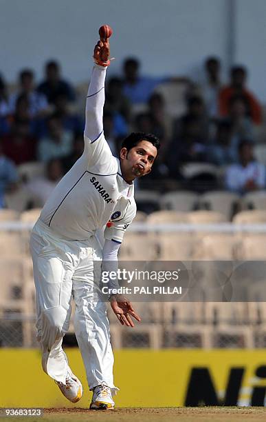 Indian cricketer Shathakumarani Sreesanth bowls on the first day of the third cricket Test between India and Sri Lanka in Mumbai on December 2, 2009....