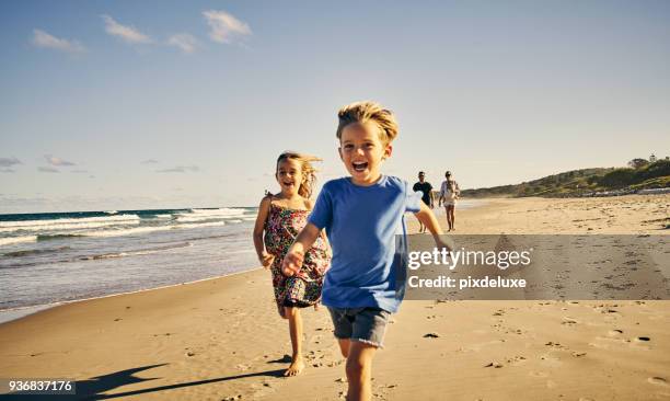 leading the way to a day of fun - children happy imagens e fotografias de stock
