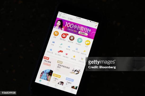 Menu icons are displayed on the Meituan application on an Apple Inc. IPhone in an arranged photograph taken in Hong Kong, China, on Friday, March 23,...