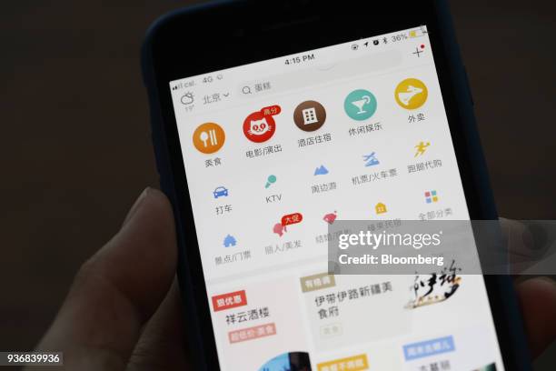 Menu icons are displayed on the Meituan application on an Apple Inc. IPhone in an arranged photograph taken in Hong Kong, China, on Friday, March 23,...