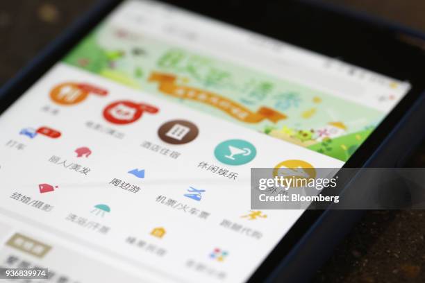 Menu icons are displayed on the Meituan application on an Apple Inc. IPhone in an arranged photograph taken in Hong Kong, China, on Friday, March 23,...