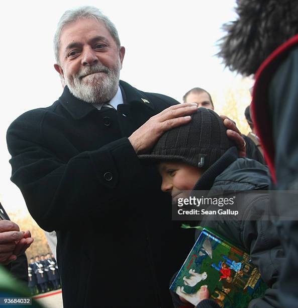 Brazilian President Luiz Inacio Lula da Silva greets children upon da Silva's arrival at Bellevue Palace on December 3, 2009 in Berlin, Germany. Da...