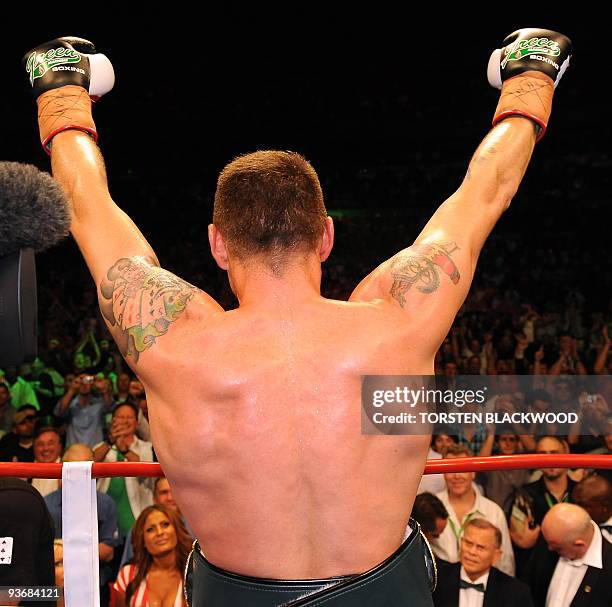 Australian titleholder Danny Green celebrates after defeating four-division world champion Roy Jones Jnr of the US in their IBO cruiserweight World...