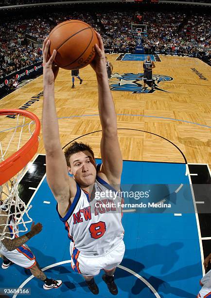 Danilo Gallinari of the New York Knicks pulls down a rebound against the Orlando Magic during the game on December 2, 2009 at Amway Arena in Orlando,...