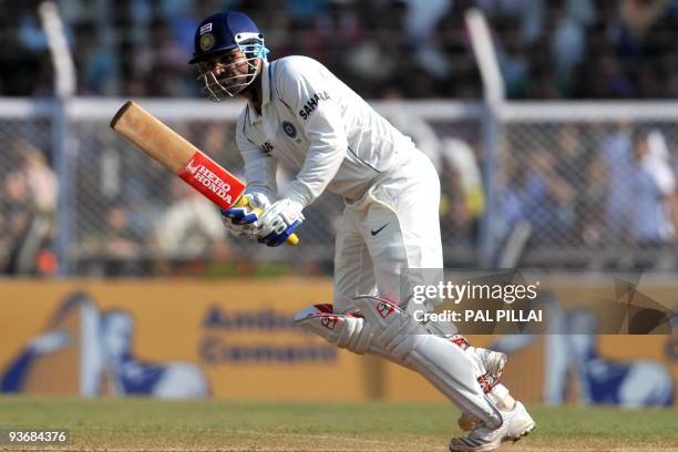 Indian cricketer Virendra Sehwag plays a shot during his unbeaten 229 runs on the second day of the third test between India and Sri Lanka in Mumbai...