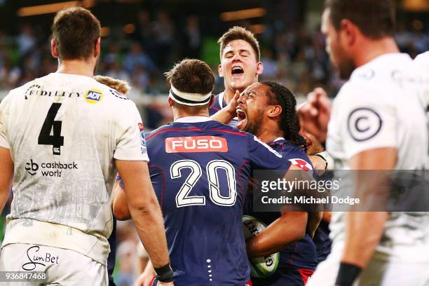 Fereti Saaga of the Rebels celebrates a try during the round six Super Rugby match between the Melbourne Rebels and the Sharks at AAMI Park on March...