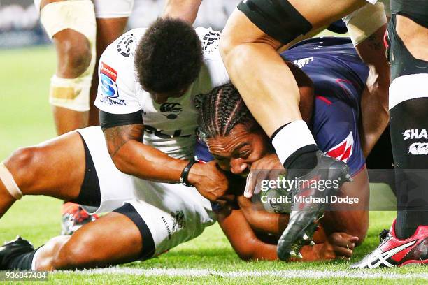 Fereti Saaga of the Rebels scores a try during the round six Super Rugby match between the Melbourne Rebels and the Sharks at AAMI Park on March 23,...