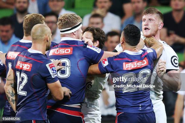 Players confront eachother after a contest during the round six Super Rugby match between the Melbourne Rebels and the Sharks at AAMI Park on March...