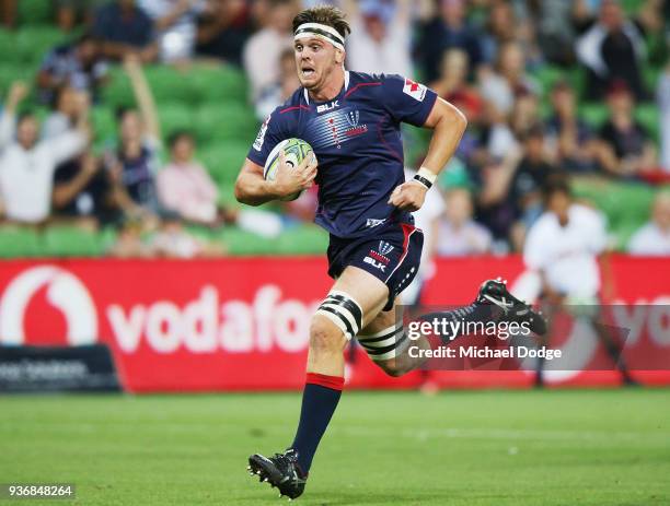 Matthew Philip of the Rebels runs with the ball to the try line during the round six Super Rugby match between the Melbourne Rebels and the Sharks at...