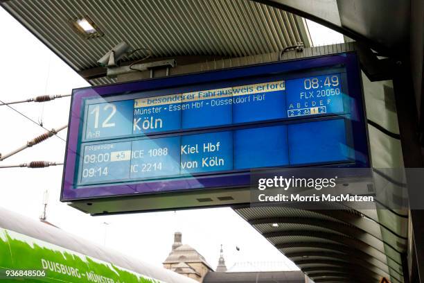 Scoreboard is pictured next to a Flixtrain as its departs from Hamburg main station on its first Journey from Hamburg to Cologne on March 23, 2018 in...