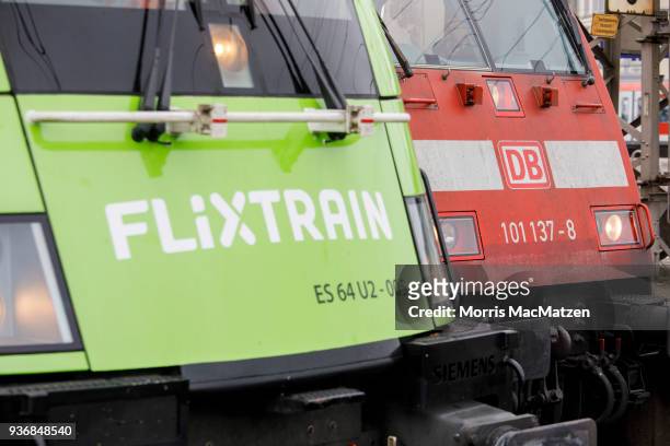 Locomotives of 'Deutsche Bahn' and its new competitor of 'Flixtrain' stand next to each other at the Altona railway station. The 'Flixtrain' is ready...
