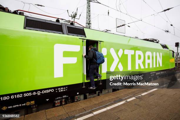 An engine driver enters the lokomotive of the Flixtrain as its ready to depart for its first Journey from Hamburg to Cologne on March 23, 2018 in...