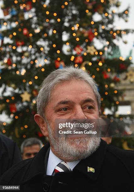 Brazilian President Luiz Inacio Lula da Silva walks by a Christmas tree at the Brandenburg Gate on December 3, 2009 in Berlin, Germany. Da Silva is...