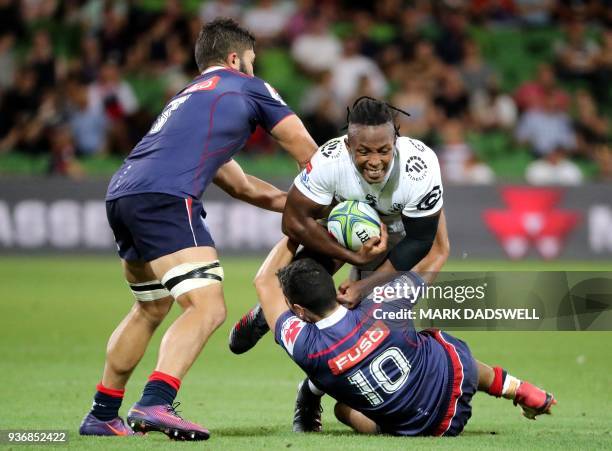 Rebels' Jack Debreczeni tackles Sbu Nkosi of the Sharks during the Super Rugby union match between the Melbourne Rebels of Australia and the Coastal...