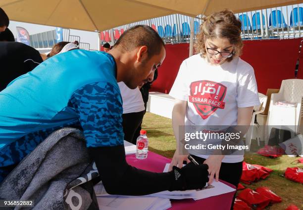 Competitors sign on to take part in the Esrar Obstacle Course Race at Aspire Park on March 23, 2018 in Doha, Qatar.